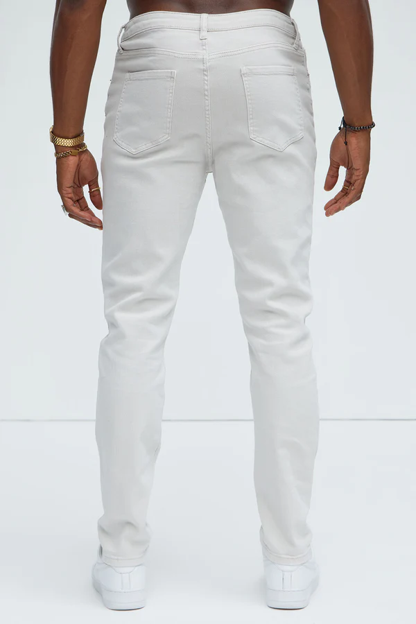 Back view of slim fit vacation jeans men in white by VacationGrabs with a modern slim cut