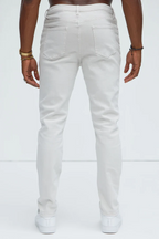 Back view of slim fit vacation jeans men in white by VacationGrabs with a modern slim cut