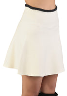 White skirt with black trim on a white background