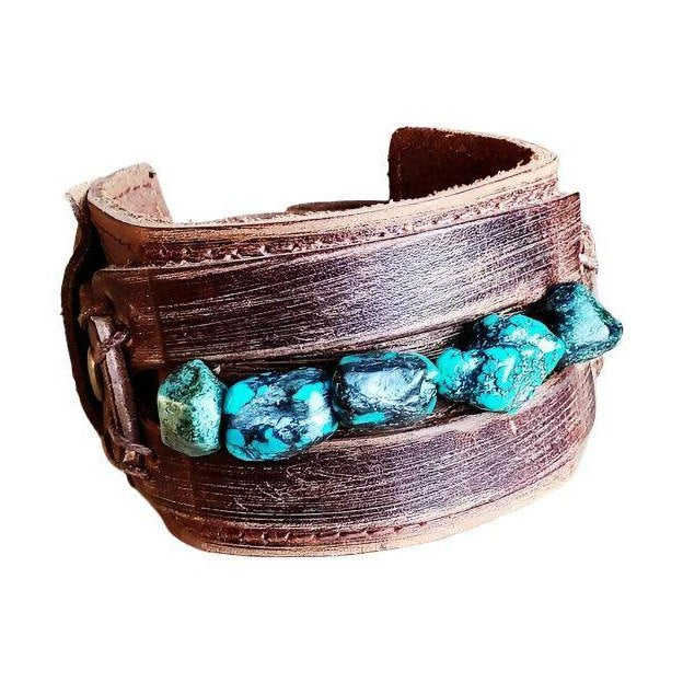 Wide cuff leather bracelet featuring turquoise stones for a trendy accessory look