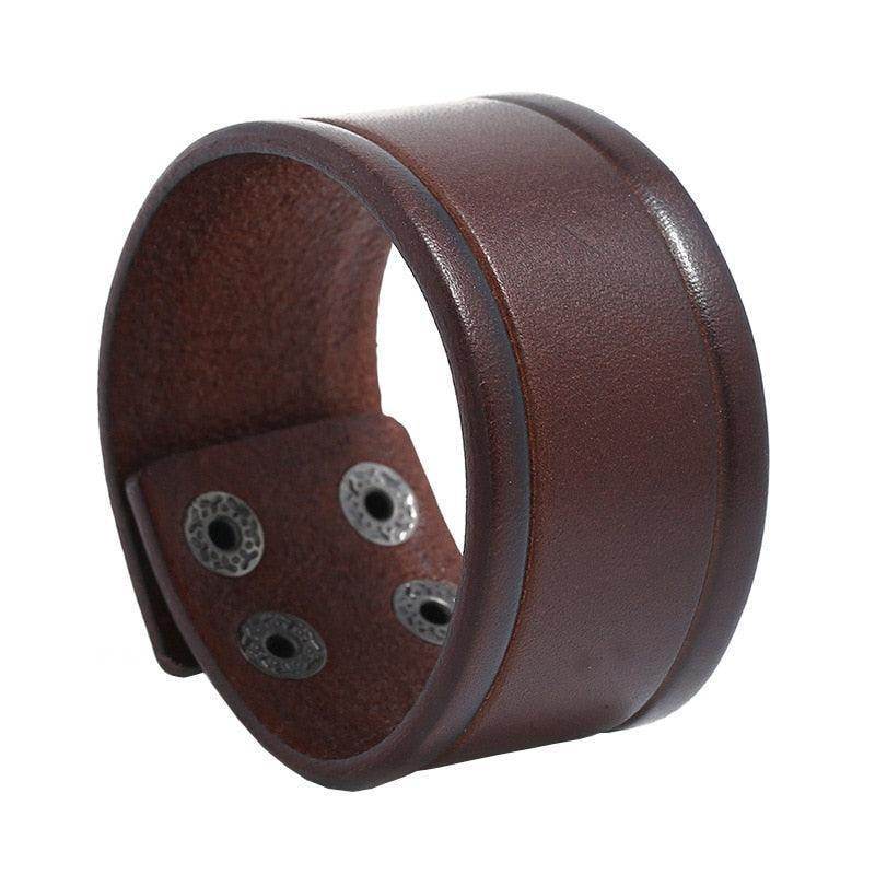 Wide cuff pu leather bracelet in brown with a smooth finish and decorative rivets
