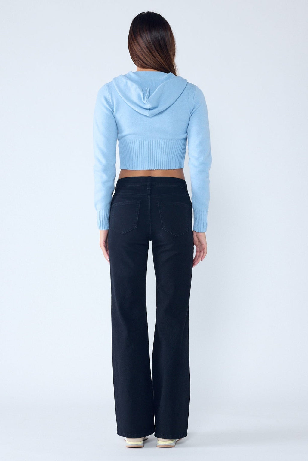 Women's black wide-leg jeans, stylish casual outfit with a cropped sweater