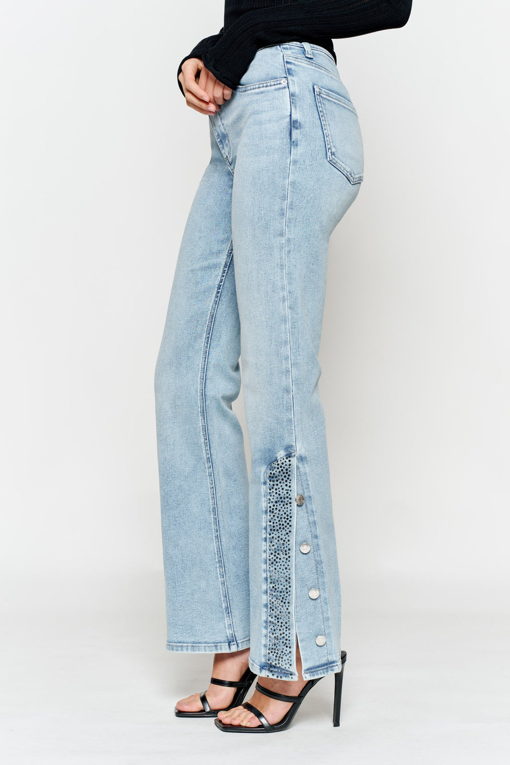 Women's light wash wide-leg jeans with button details, stylish fit