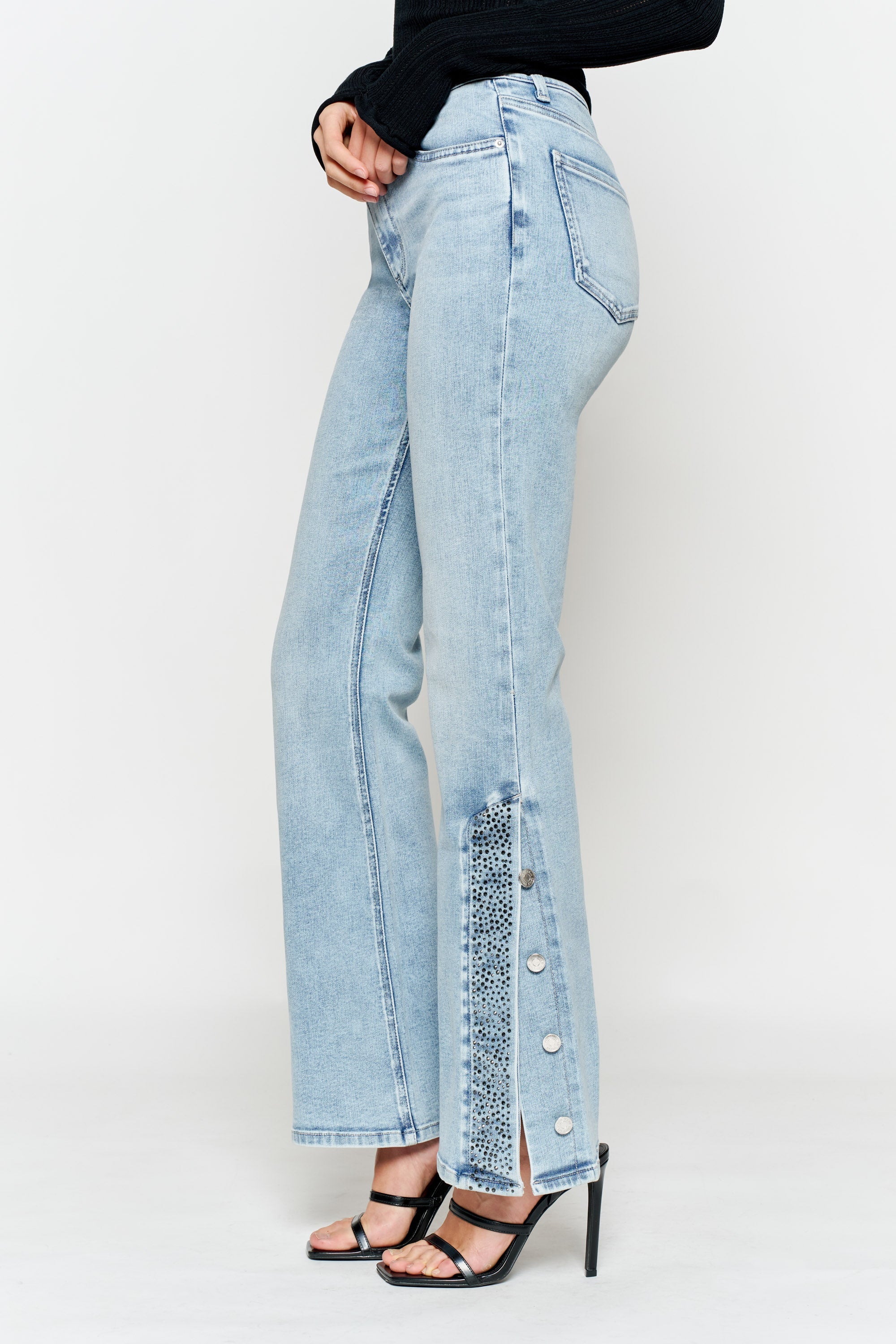 Women's light wash wide-leg jeans with button details, stylish fit