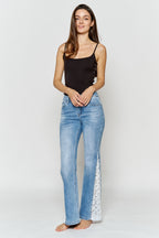 Women's blue wide-leg jeans with lace detail, stylish for casual outings
