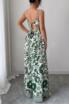 Back view of a floral wide leg vacation jumpsuit with adjustable tie detail for stylish comfort