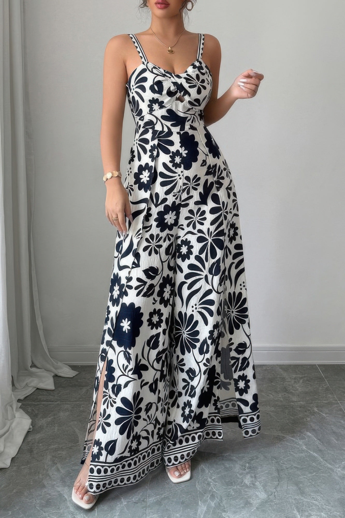 Stylish wide leg vacation jumpsuit with floral design and side slits for a chic summer look