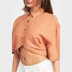 Emory Park wide sleeve crop top in soft peach color with button details and relaxed fit for stylish comfort