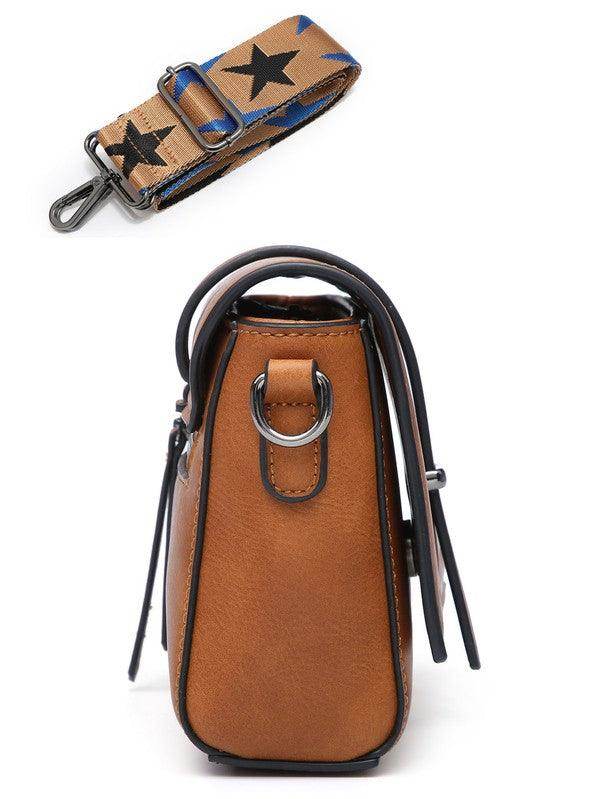 Side view of a Sifides wide strap shoulder bag in brown leather with a stylish star-patterned strap