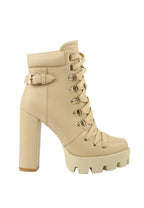 Beige platform boot with block heel on a white background