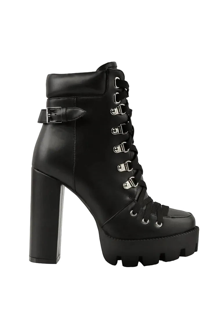 Black platform boot with high heel on a white background