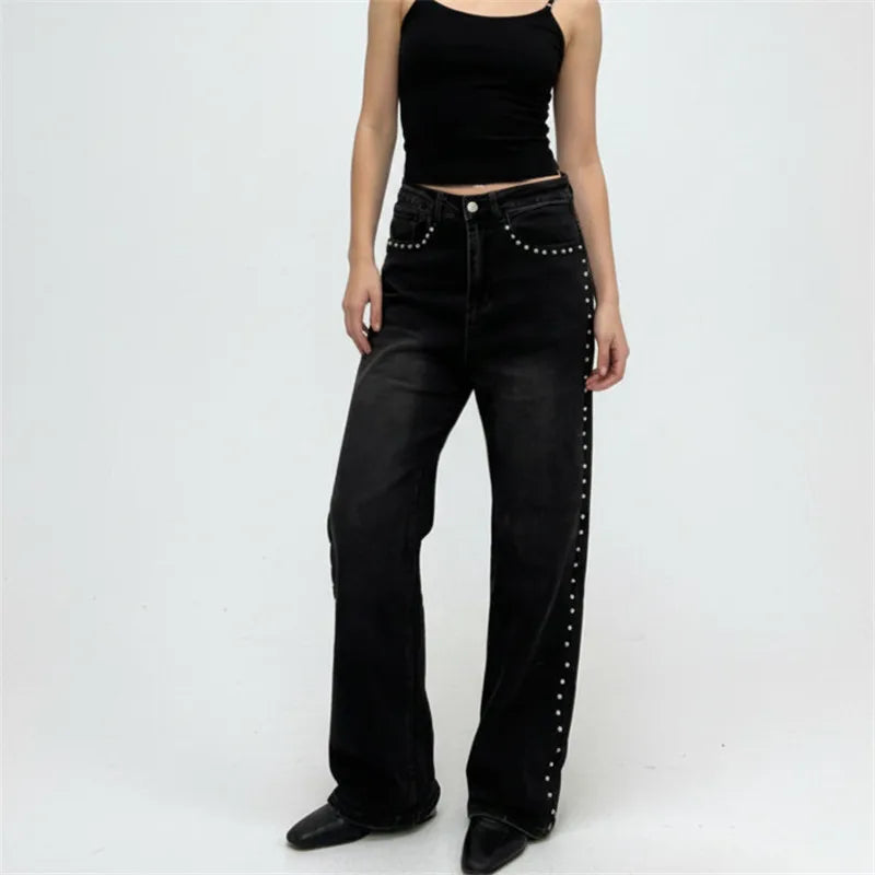 women in jeans, black with studded details, casual style