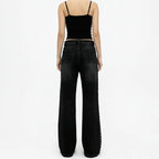 Women in jeans with a black top, stylish wide-leg design