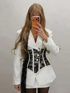 Women's stylish white blazer with lace corset detail, perfect for parties