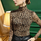 Leopard print mesh sheer top women with long sleeves and high neck styled with black leather pants
