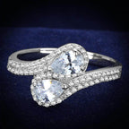 Stunning rhodium plated sterling silver fashion ring featuring two pear-shaped stones with sparkling accents