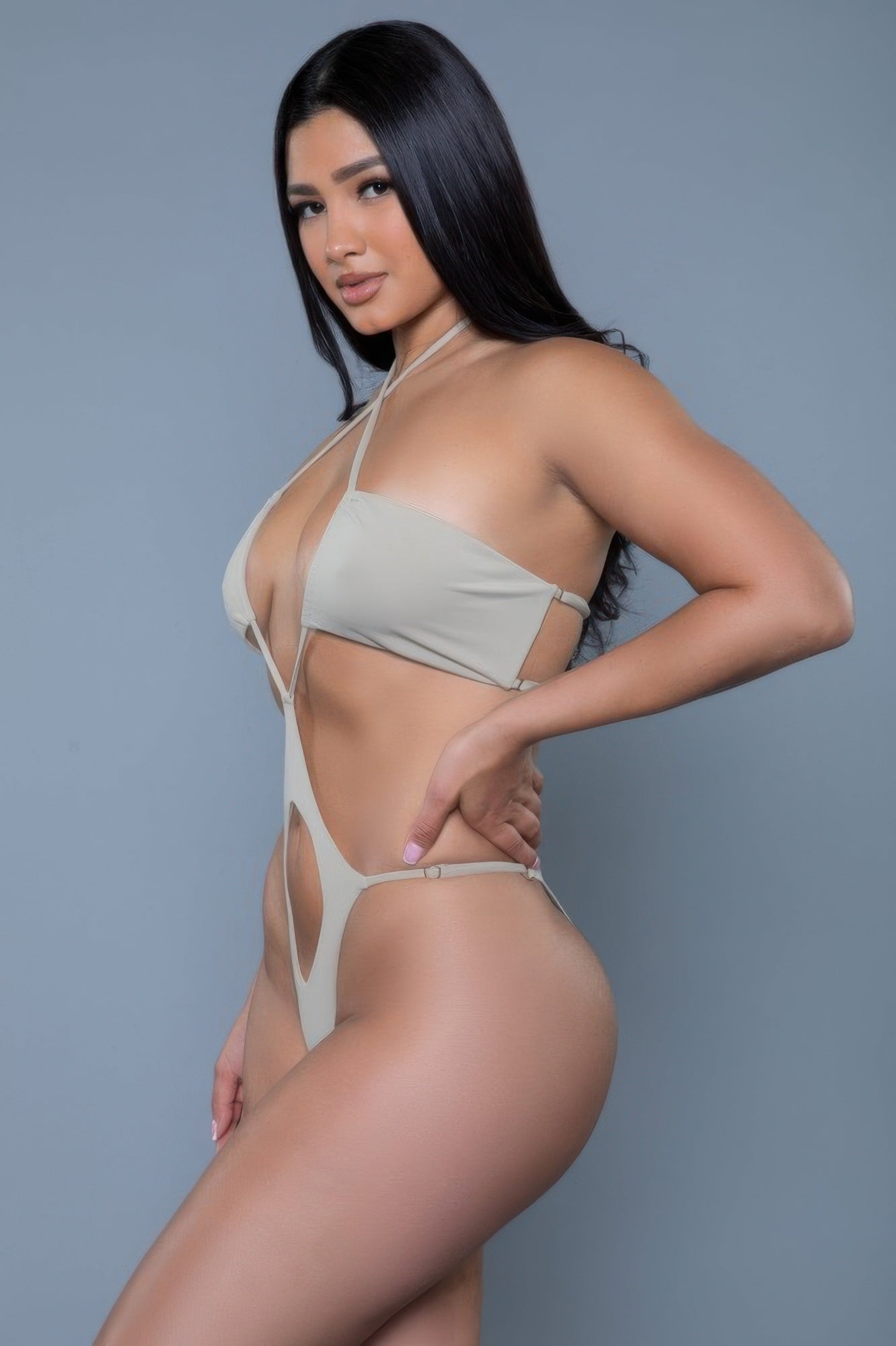 Stylish beige sexy monokini for women featuring unique cutouts and adjustable straps