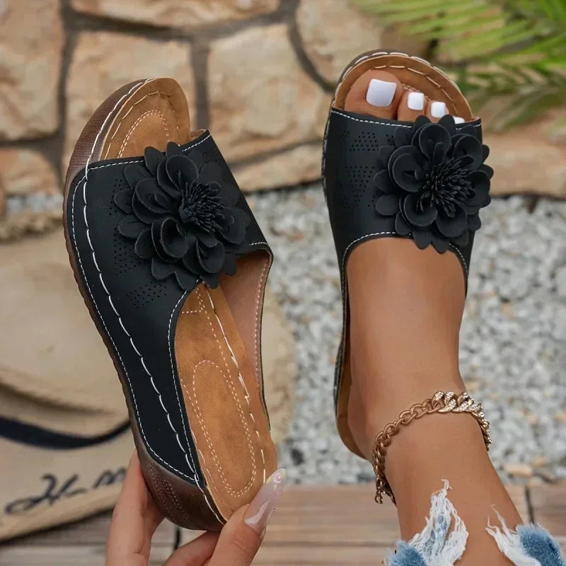 women slippers ugg in black with floral detail for casual wear