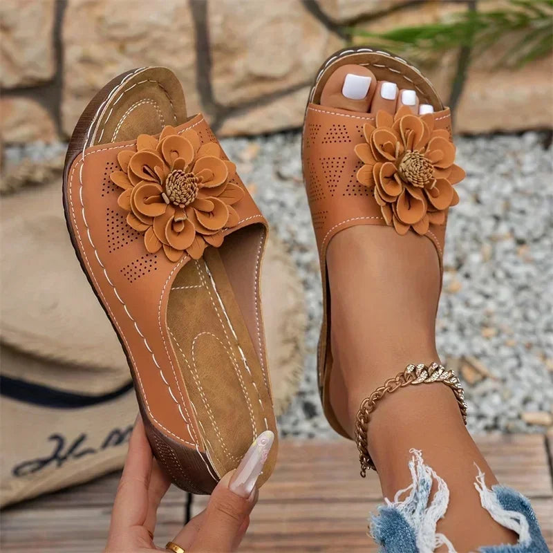 women slippers ugg in tan with flower embellishment for casual wear