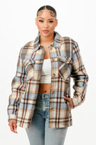 Stylish warm flannel jacket for women with a plaid pattern and front pockets, perfect for layering