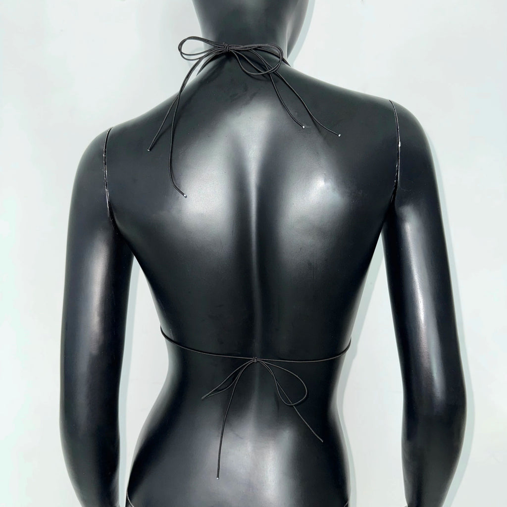 Back view of a sleek black bikini top, perfect for beach days