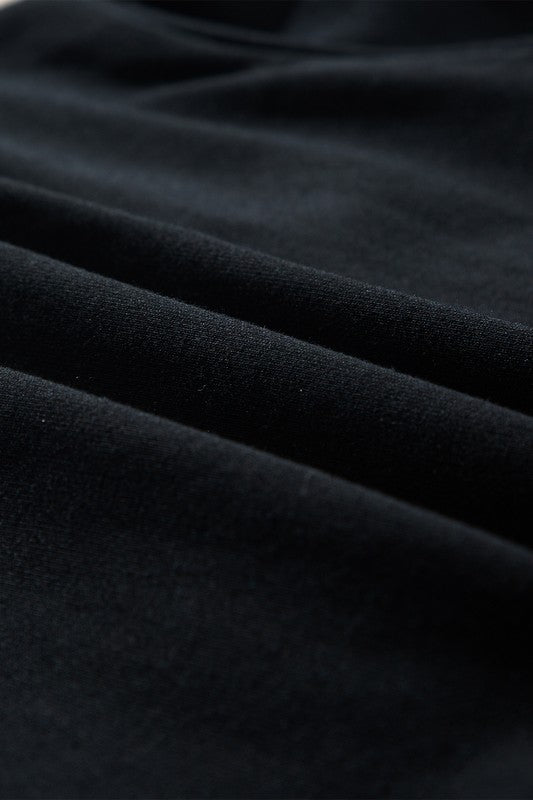 Close-up of soft black fabric texture for womens cozy Christmas matching set by SHEWIN INC