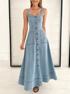 Light blue women's denim backless dress with button-down front and spacious pockets