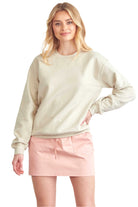 BLUME AND CO. women's drawstring skirt with pockets in light pink worn with a beige sweatshirt