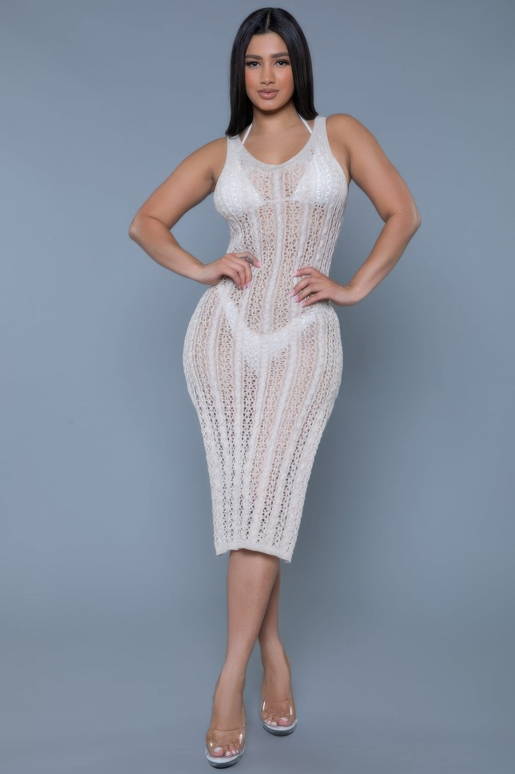 Women's fitted dress in white crochet style, perfect for beach outings