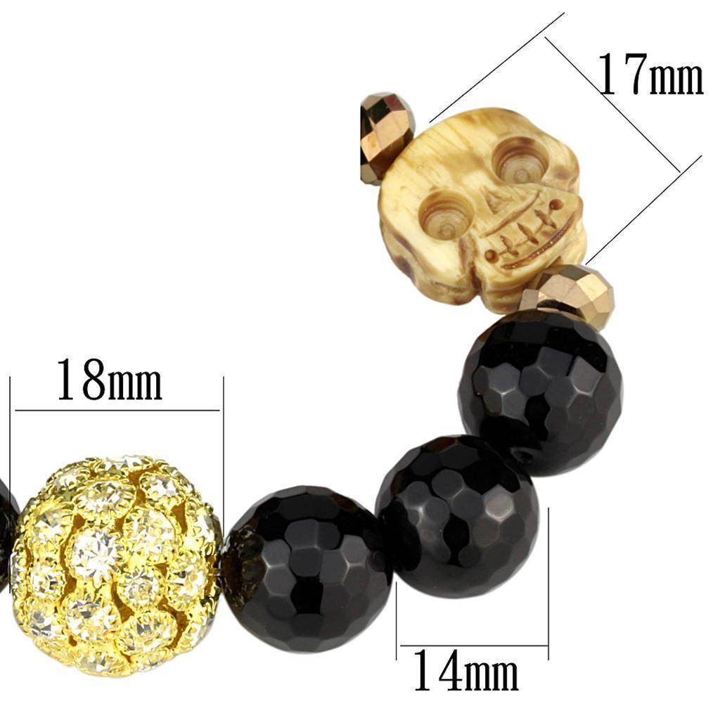 Chic women's gold brass bracelet featuring black beads and decorative skull charm for a trendy look
