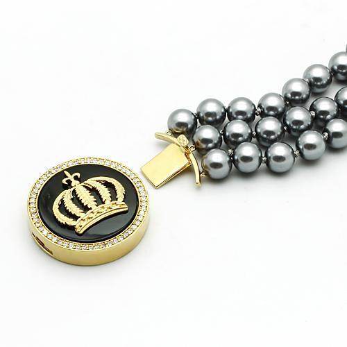 Stylish women's gold brass bracelet with crown design and gray pearl accents for elegant occasions