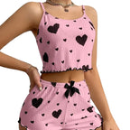 Women's heart print pajama set in pink, perfect for sleep or lounging