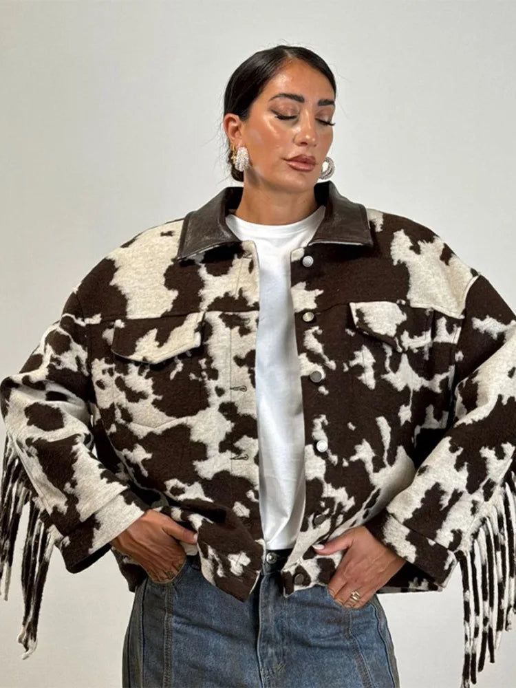 Women's puffer jacket in brown and white cow print, stylish and cozy