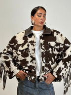 Women's puffer jacket in brown and white cow print, stylish and cozy