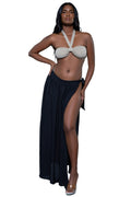Women's swimwear with halter top and long black skirt, beach ready