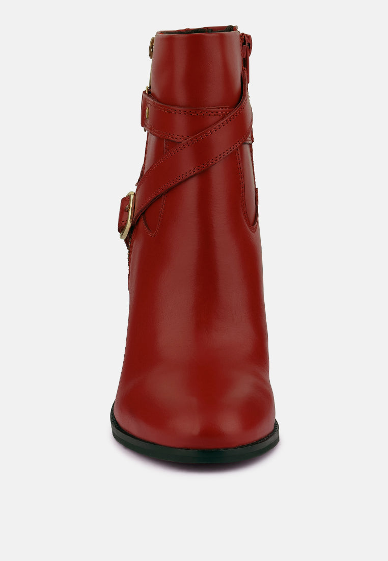 Stylish red women's leather ankle boots with a side zip and buckle detail for a chic look