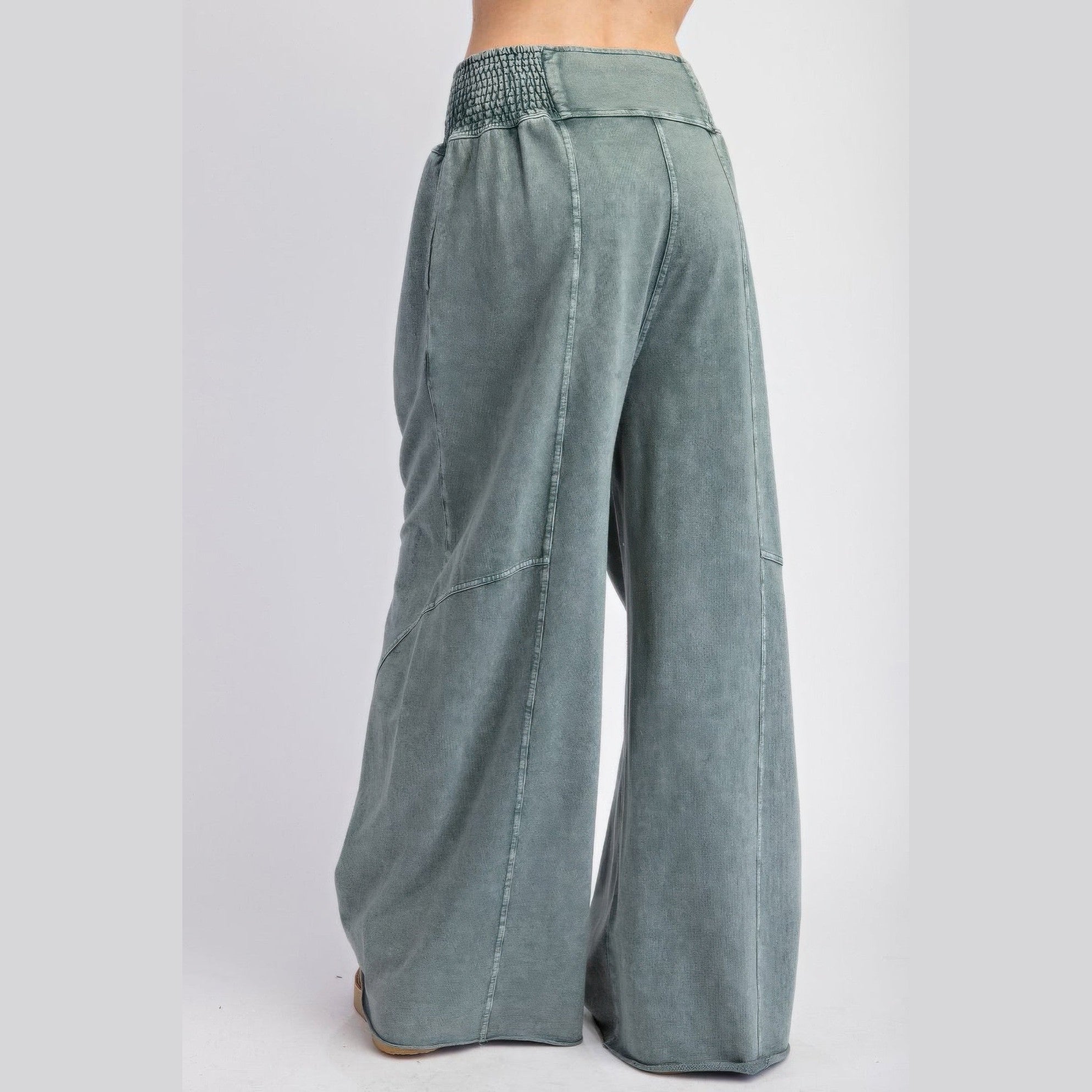 VacationGrabs women wearing grey womens loungewear travel pants with wide legs and elastic waistband