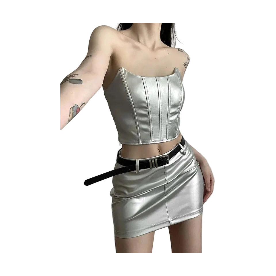 Womens metallic skirt and crop top set in silver with a black belt worn by model