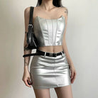 Womens metallic skirt and crop top set in silver with black belt and shoulder bag