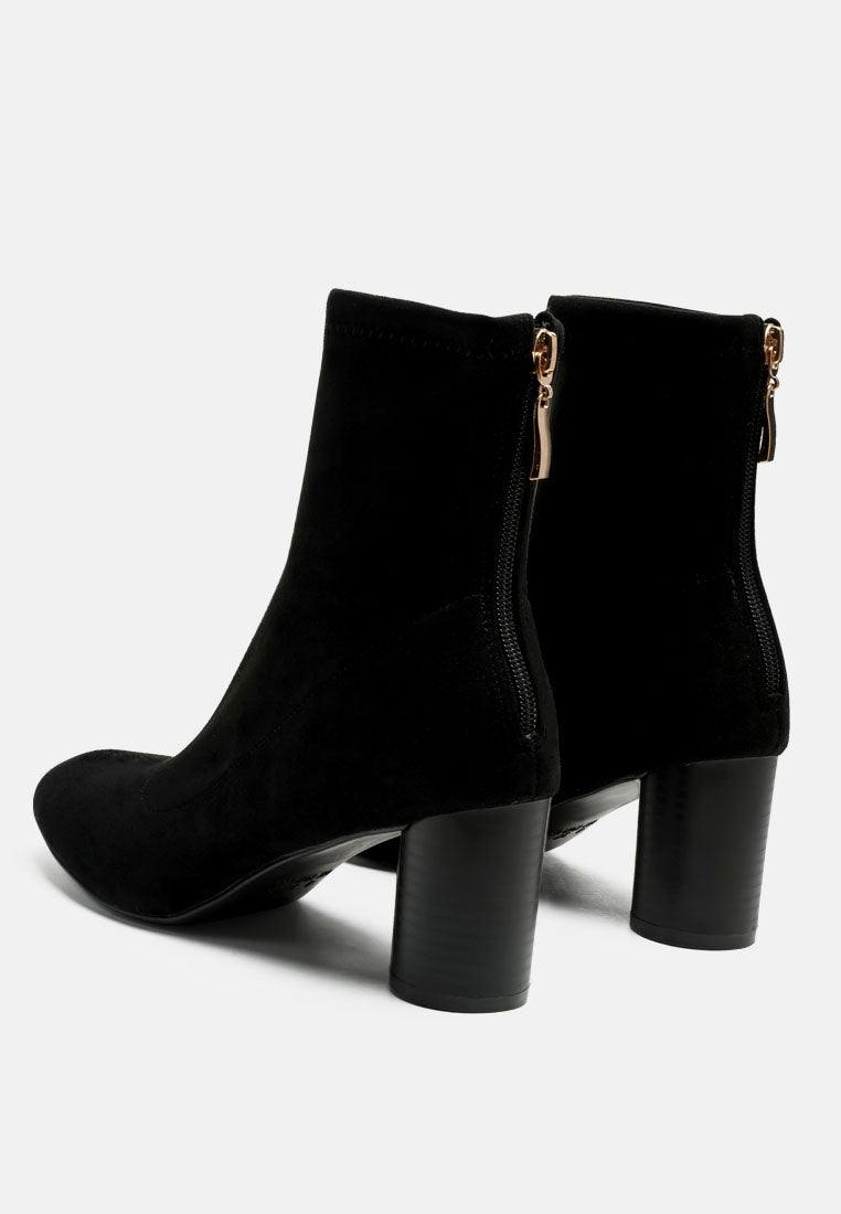Stylish women's micro suede ankle boots with a chic block heel and zip closure