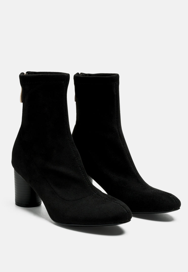 Stylish black women's micro suede ankle boots with tapered heels and zipper closure