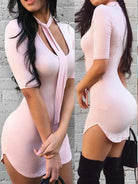 Light pink womens mini dress for club and party with short sleeves and side slit worn with black boots