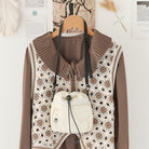 Women's nylon drawstring bucket bag with a stylish design and adjustable strap, perfect for casual outings