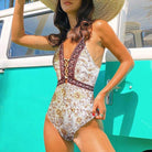 Elegant women's one piece swimwear with floral design and lace-up detail for beach outings