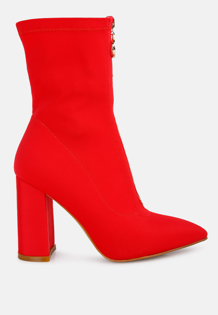 Stylish women's red block heel ankle boots featuring a sleek zip closure for a modern look