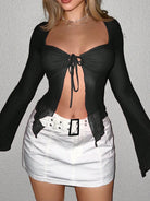 womens sexy navel exposed shirt in black long sleeves with front tie paired with white mini skirt