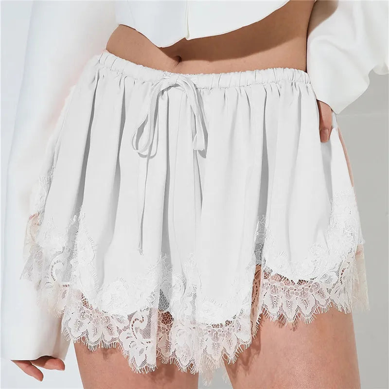 Women's white shorts with lace trim, perfect for summer outings