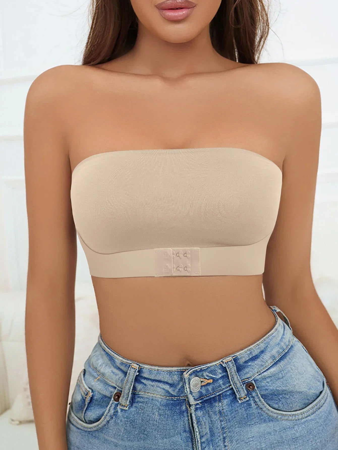 Women's strapless seamless bra in nude, perfect for undergarment layering
