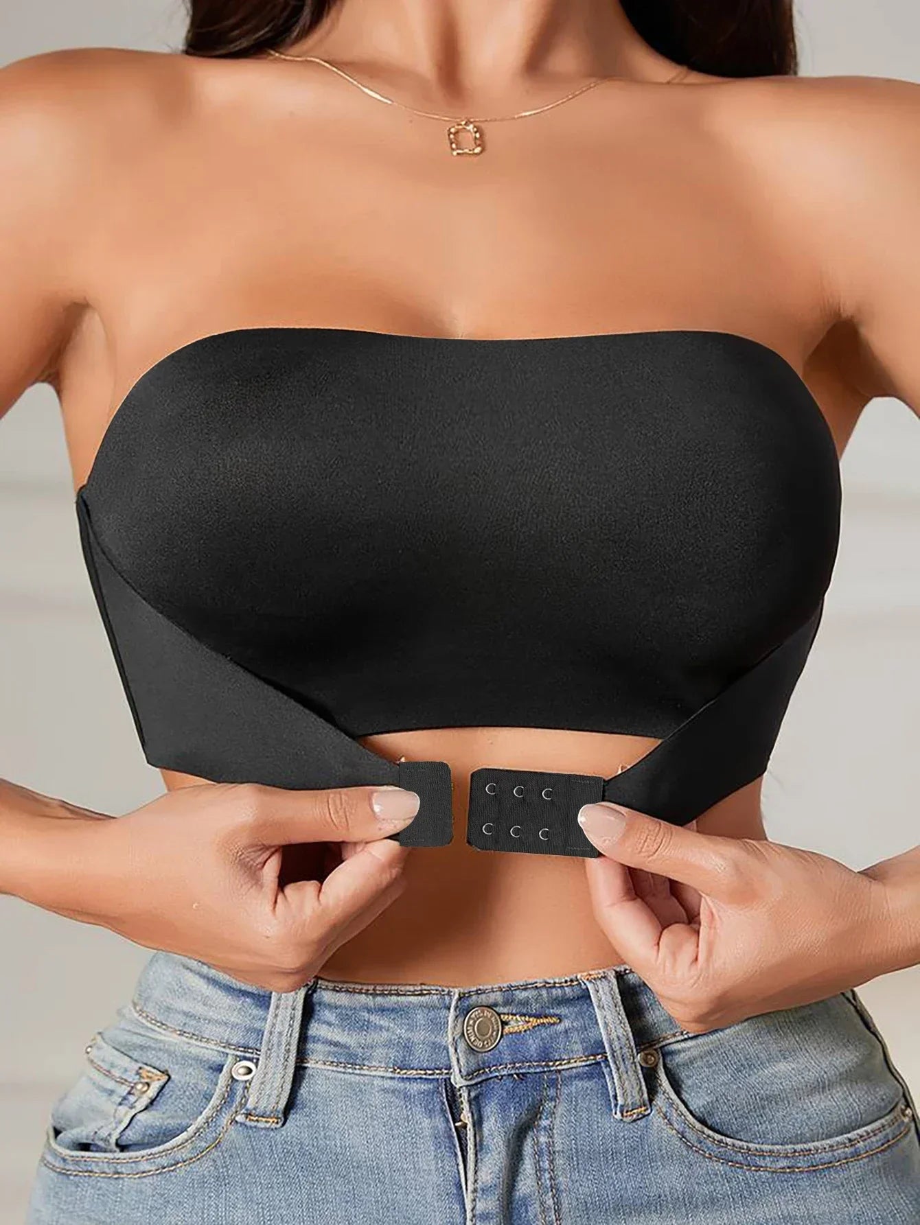 Women's strapless seamless bra in black, ideal for smooth layering