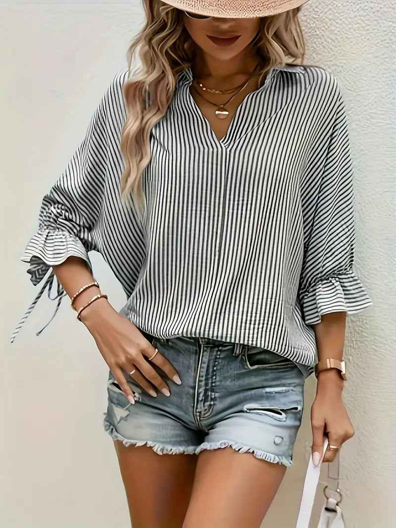 SHOMICOBOUTIQUE women's striped blouse with a relaxed fit and ruffle sleeves, paired with denim shorts